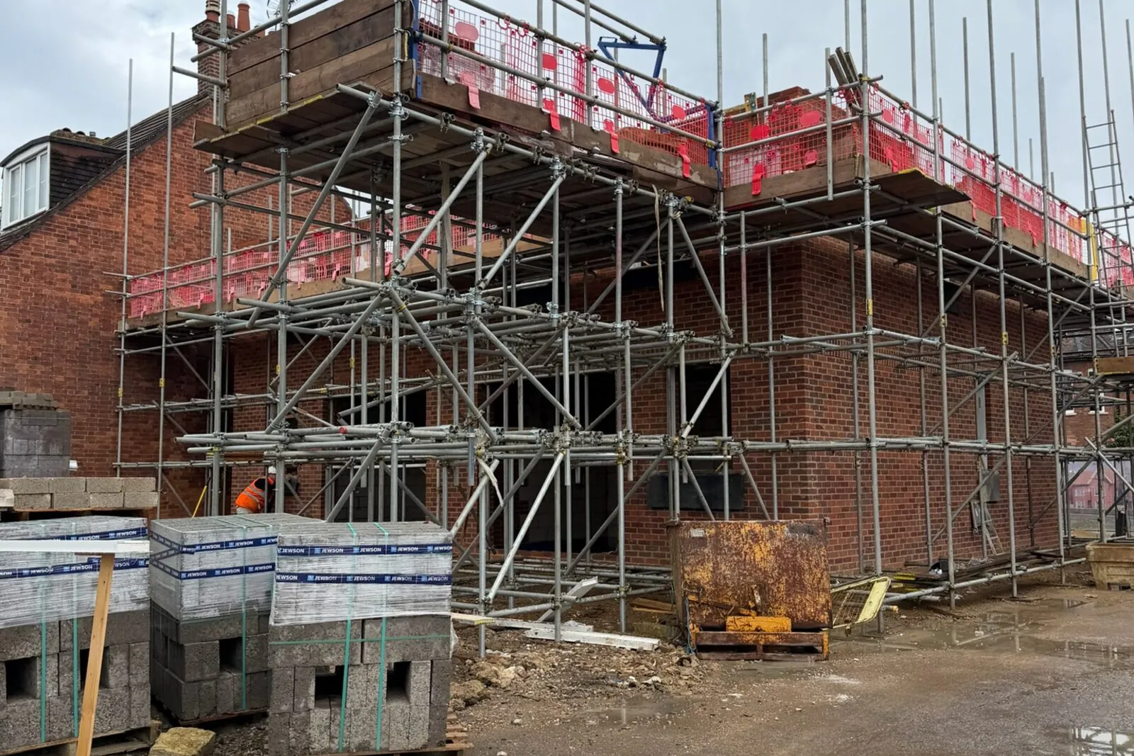 New-build three-storey houses under construction in central Bedford