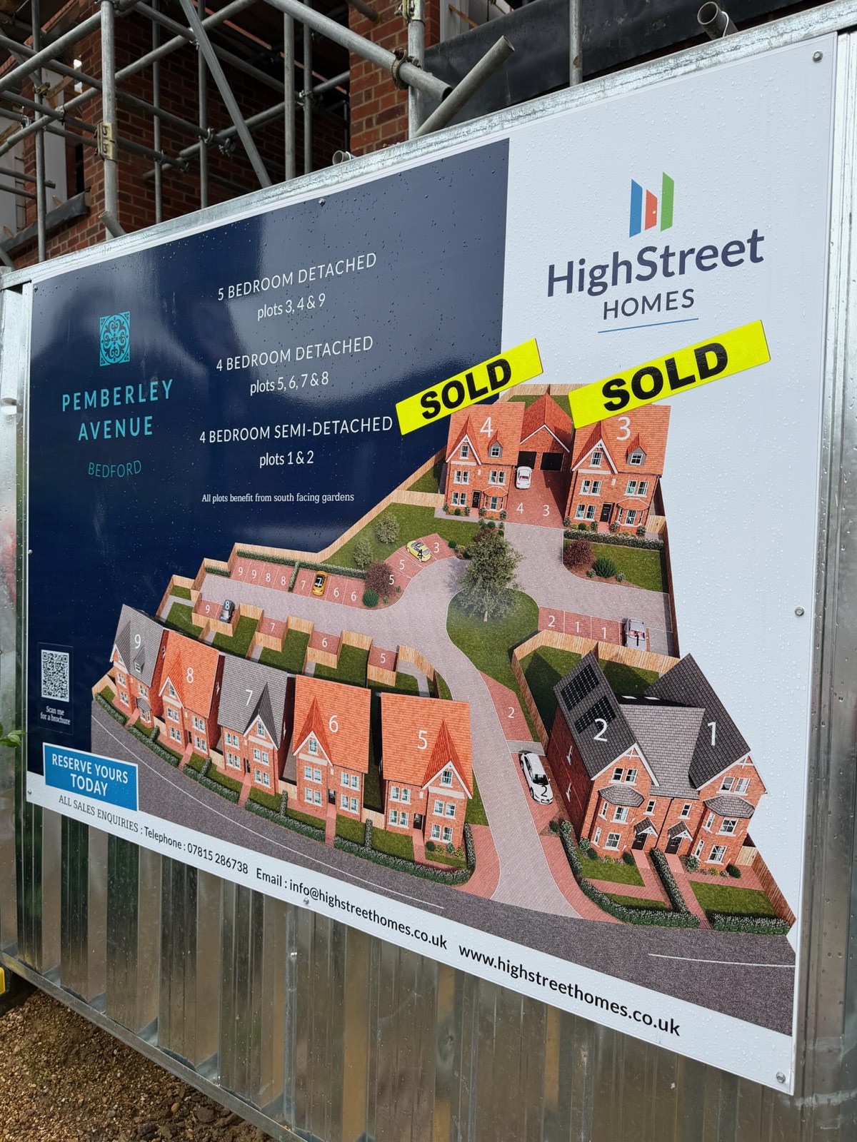 High Street Homes site board showing nine detached and semi-detached family homes in Bedford