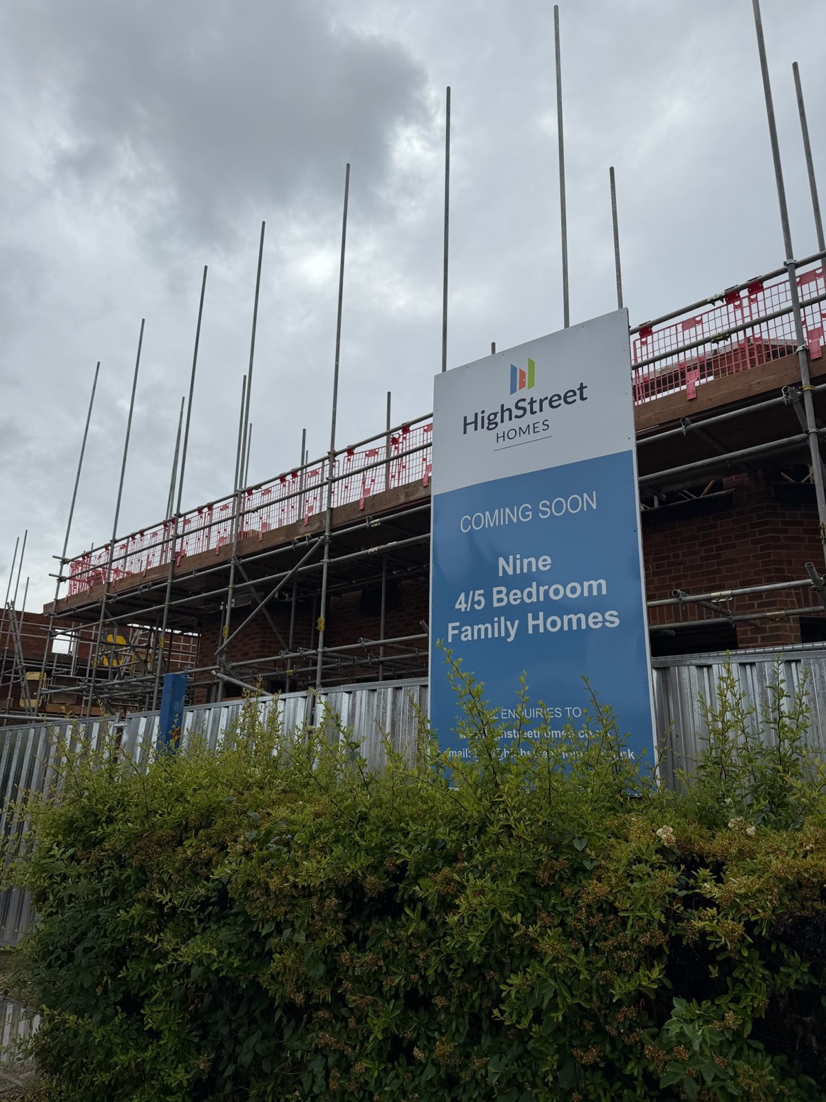 Coming soon hoarding for nine new four and five-bedroom homes in central Bedford