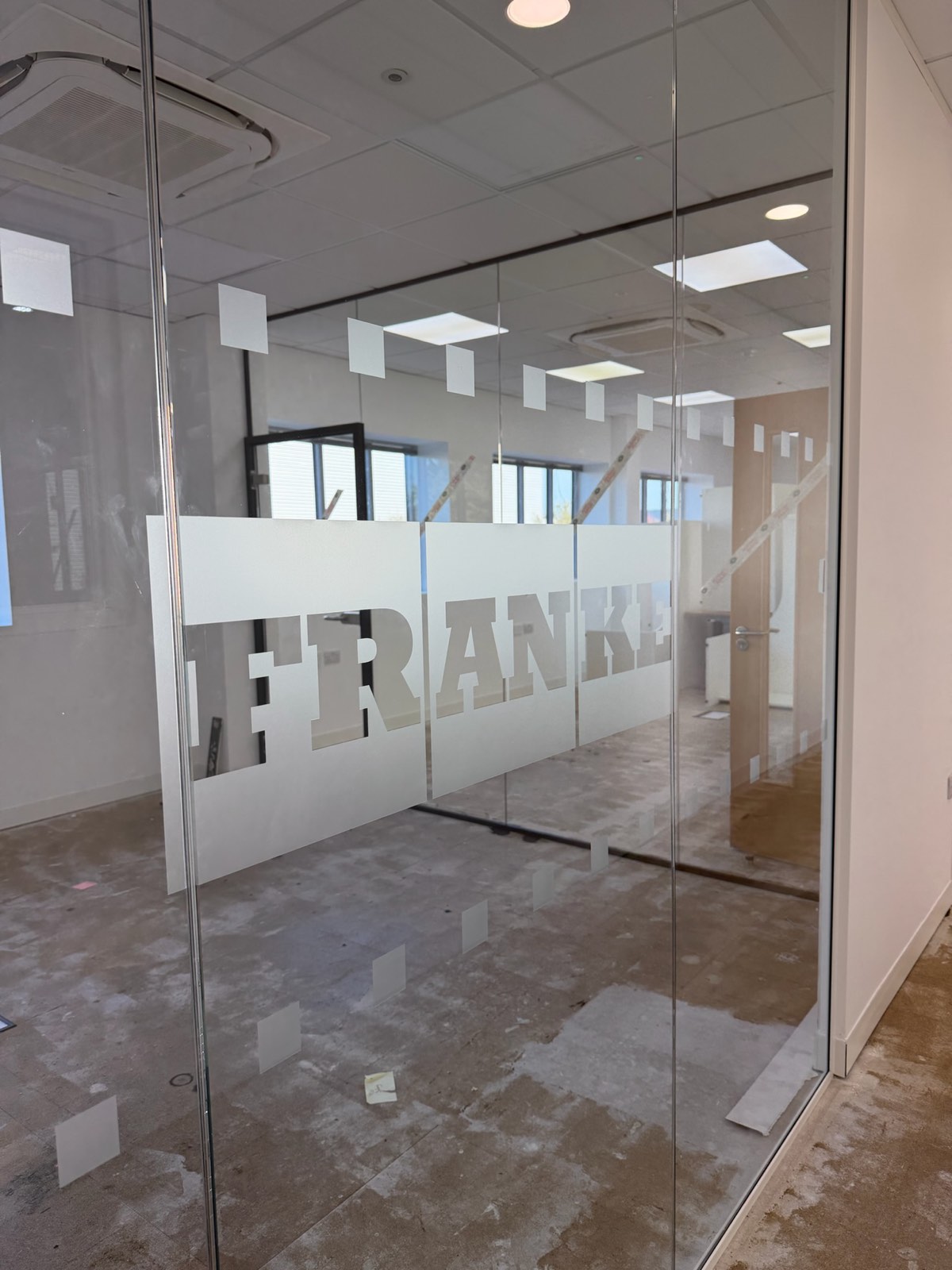New frameless glass office partitions with frosted manifestation graphics