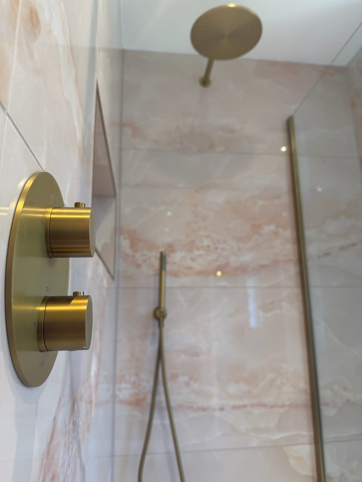 Concealed thermostatic shower valve in brushed brass
