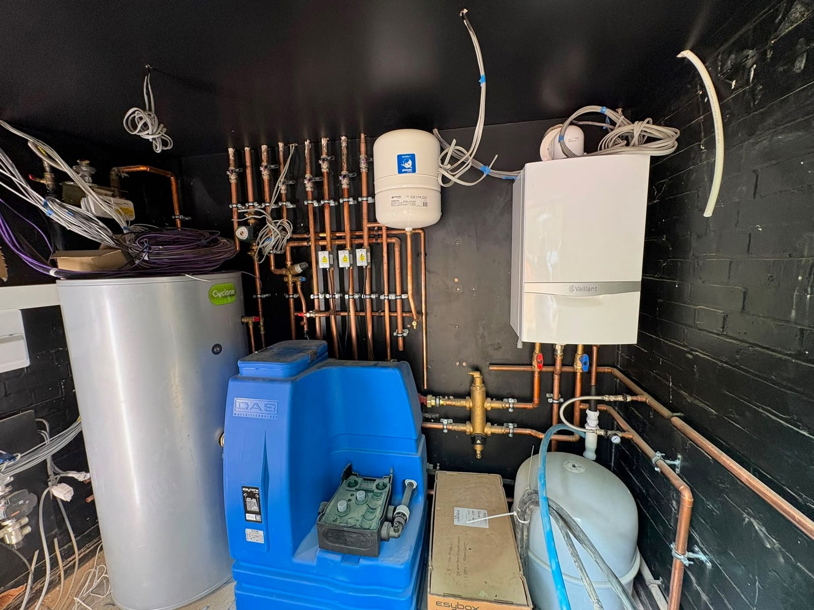 Domestic plant room with a Vaillant boiler, unvented cylinder, accumulator and copper pipework