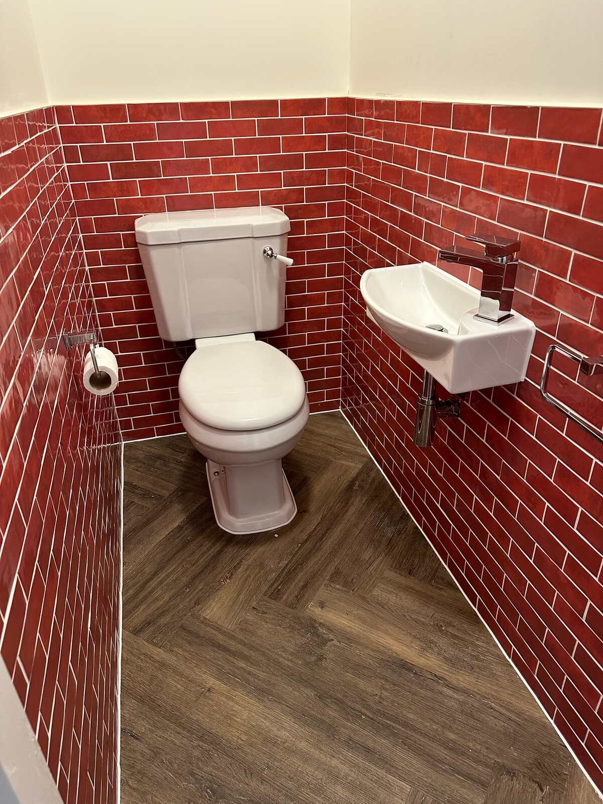 Recent WC installation with red metro tile and herringbone floor